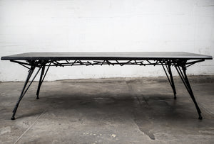 Photo of the Birdsnest Table made out of an ebonized white ash top and blackened steel base that resembles the branches of a birdsnest.