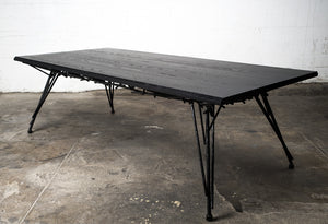 Photo of the Birdsnest Table made out of an ebonized white ash top and blackened steel base that resembles the branches of a birdsnest.