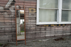 Full length leaning hardwood mirror