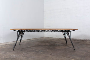 Photo of the Birdsnest Table made out of an ebonized white ash top and blackened steel base that resembles the branches of a birdsnest.
